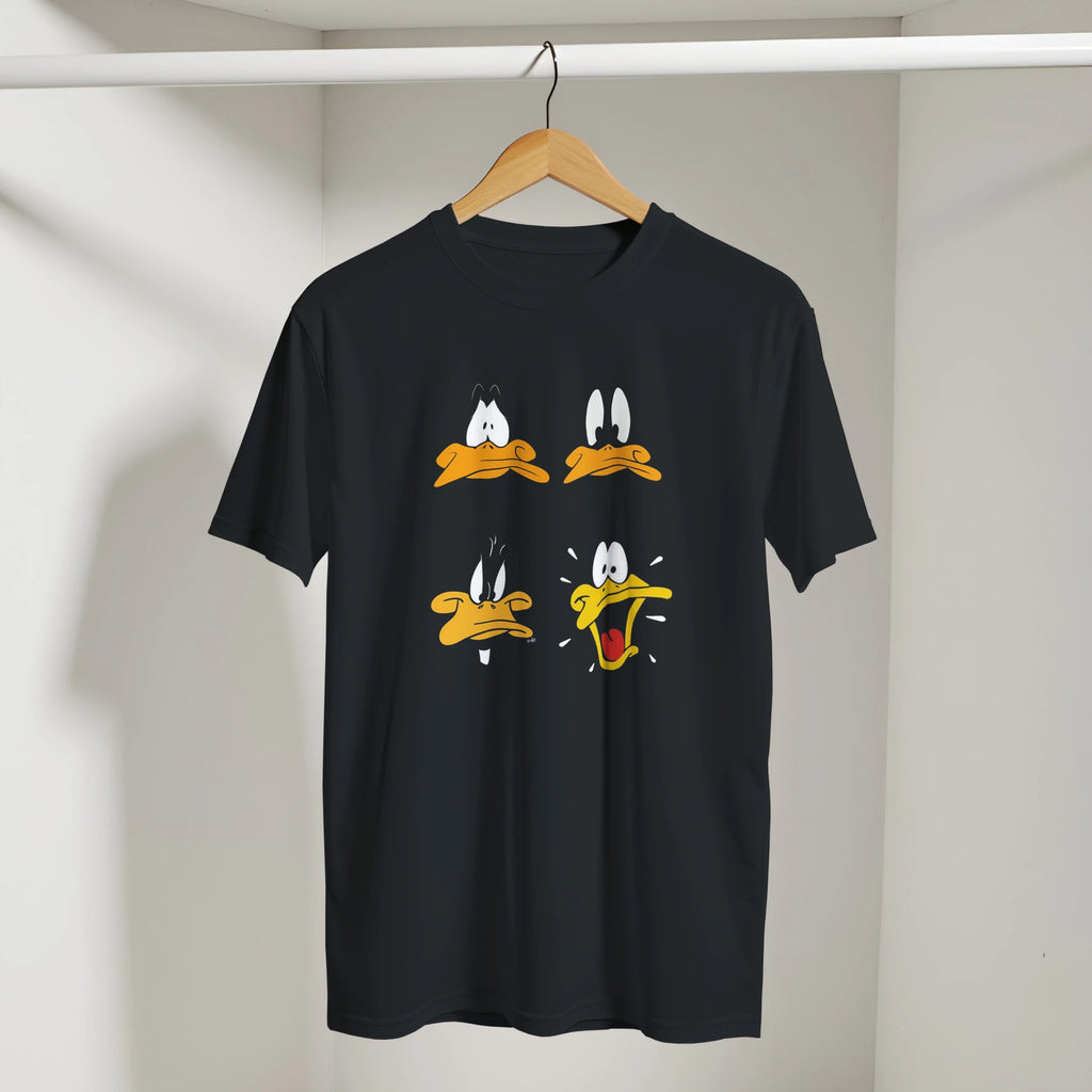 Black t-shirt with cartoon face designs on a hanger against a neutral background